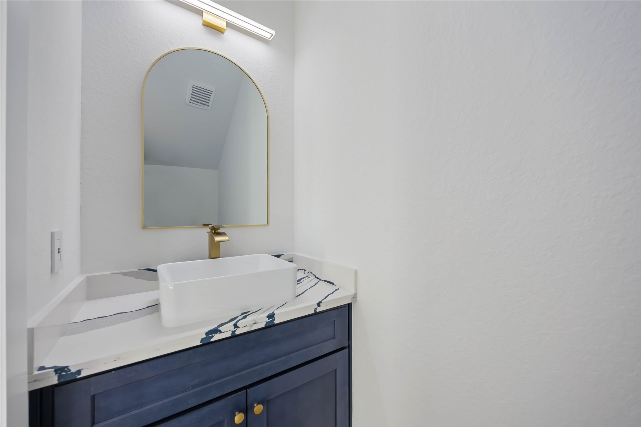 4533 Bricker Street Houston, TX 77051 - Photo 12 of 21 a bathroom with a sink and a mirror