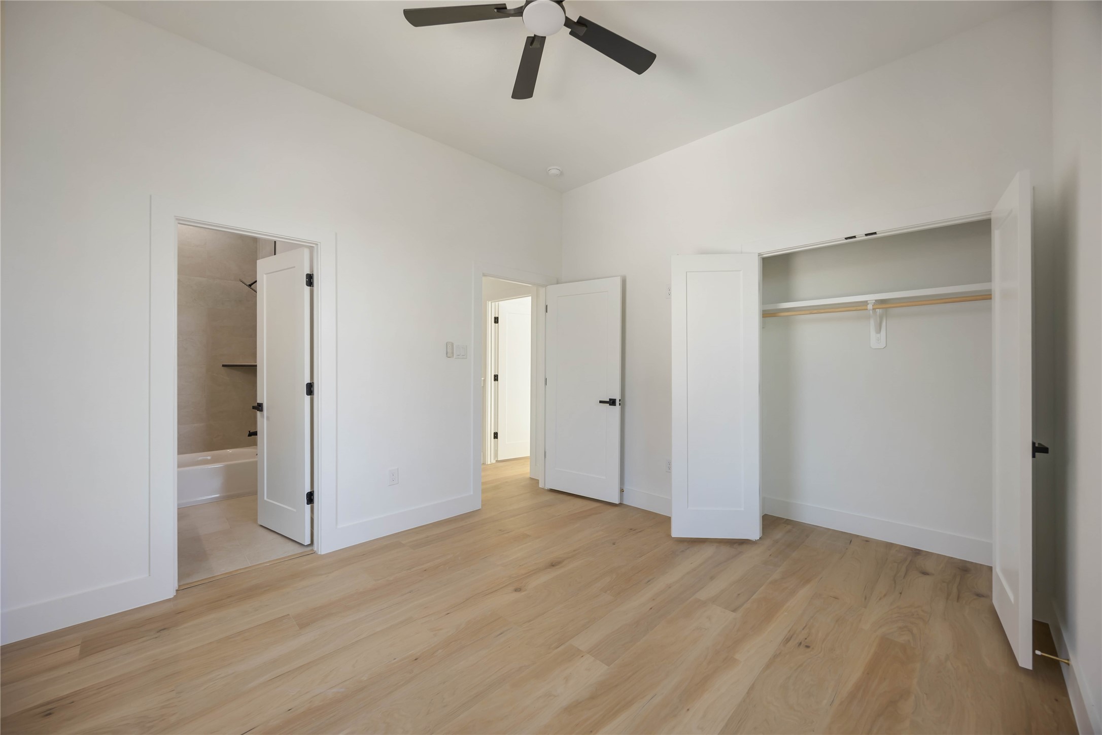 4533 Bricker Street Houston, TX 77051 - Photo 15 of 21 a view of empty room with wooden floor and ceiling fan