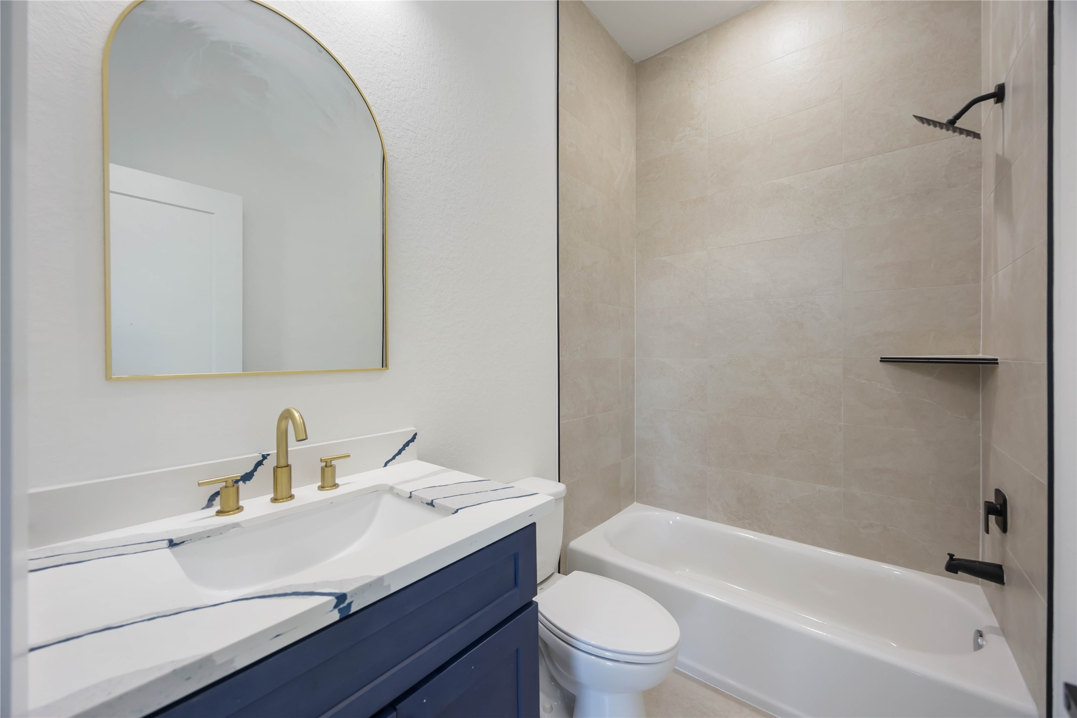 4533 Bricker Street Houston, TX 77051 - Photo 16 of 21 a bathroom with a sink toilet vanity and bathtub