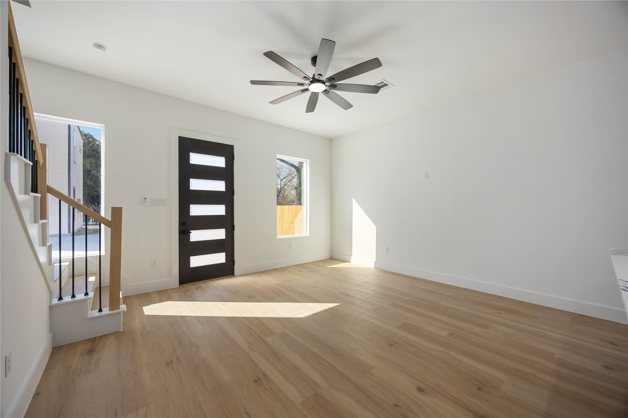 4533 Bricker Street Houston, TX 77051 - Photo 6 of 21 wooden floor in an empty room with a window