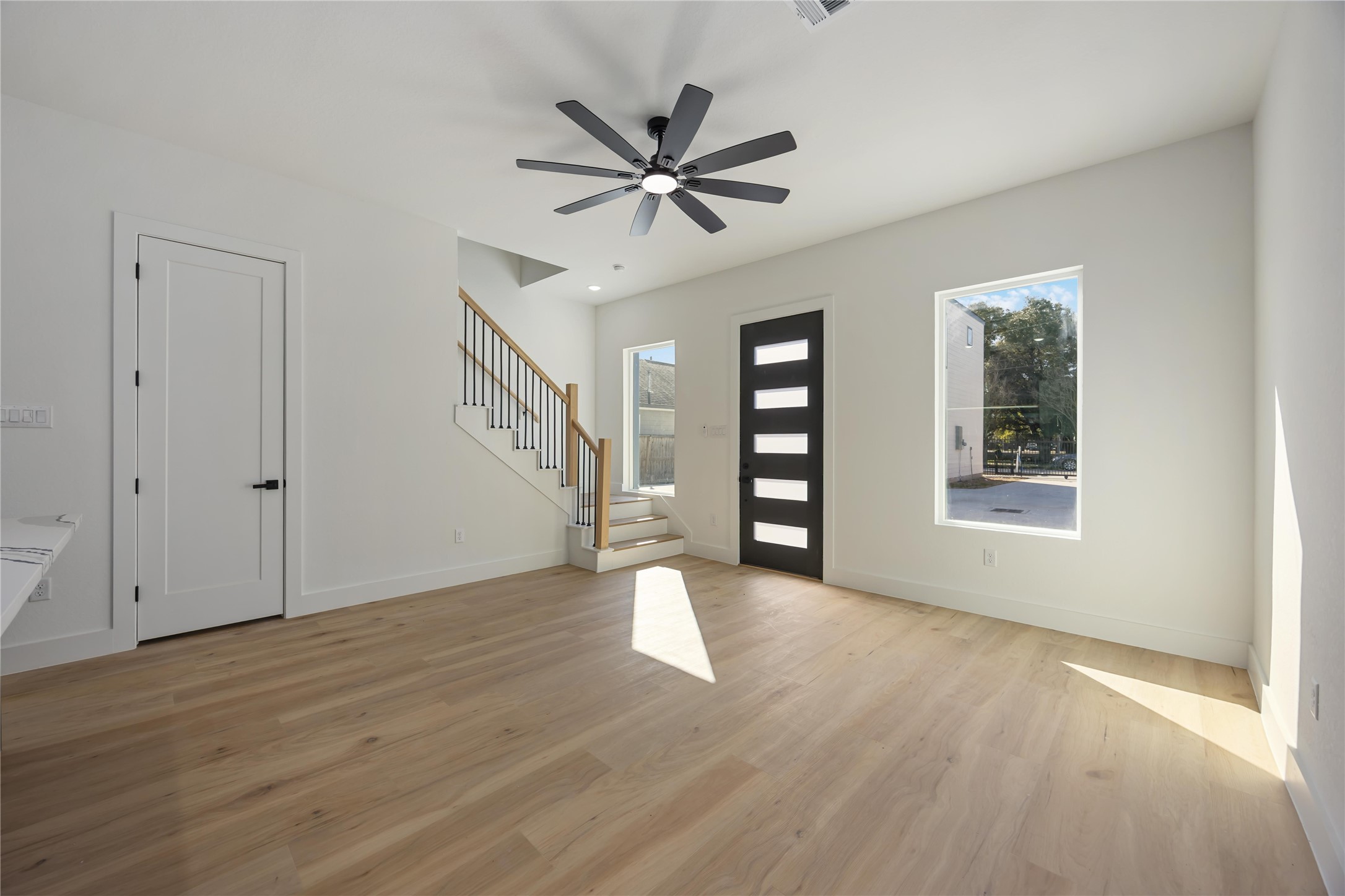 4533 Bricker Street Houston, TX 77051 - Photo 7 of 21 a view of an empty room with wooden floor and a window