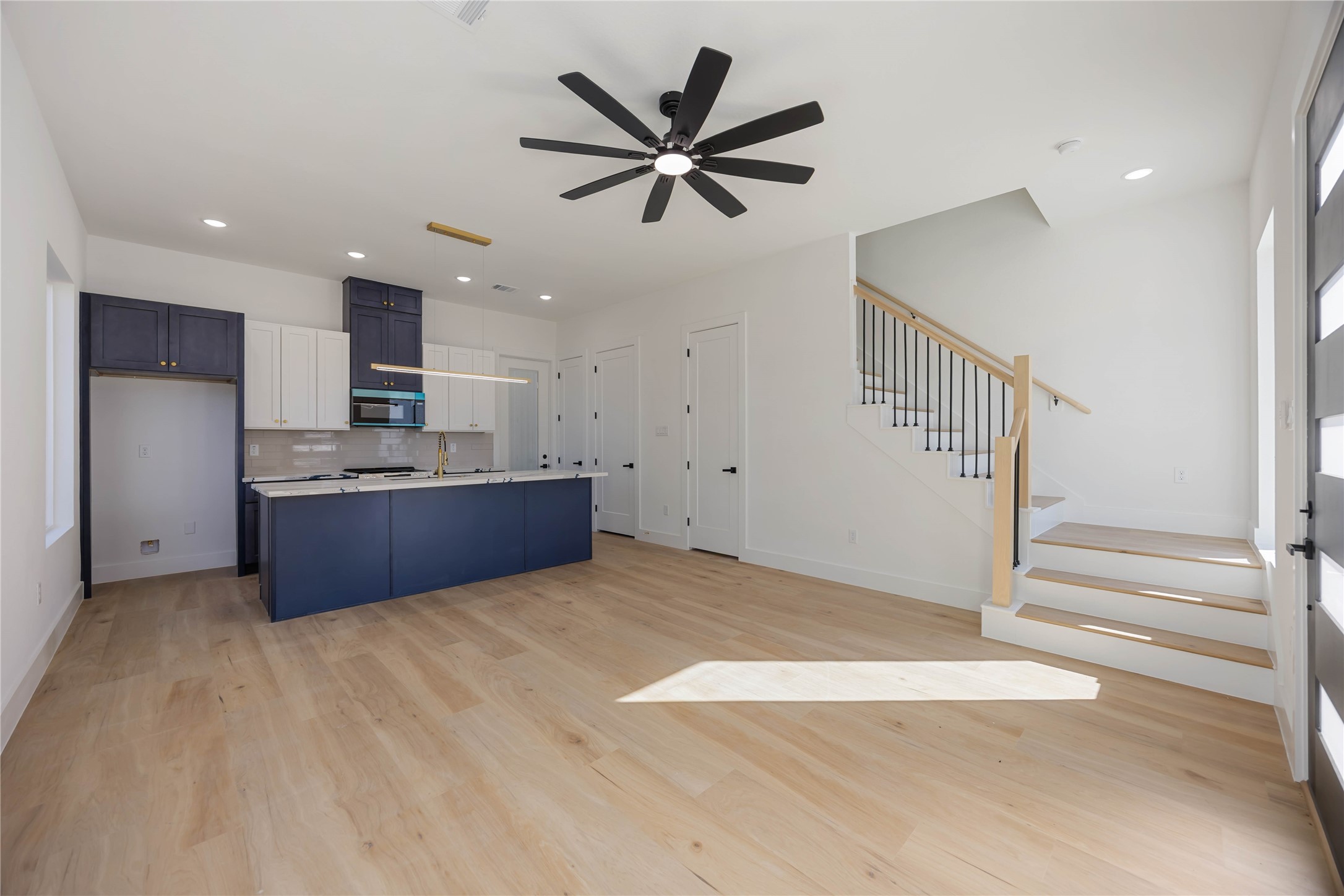 4533 Bricker Street Houston, TX 77051 - Photo 8 of 21 a view of kitchen with cabinets and wooden floor