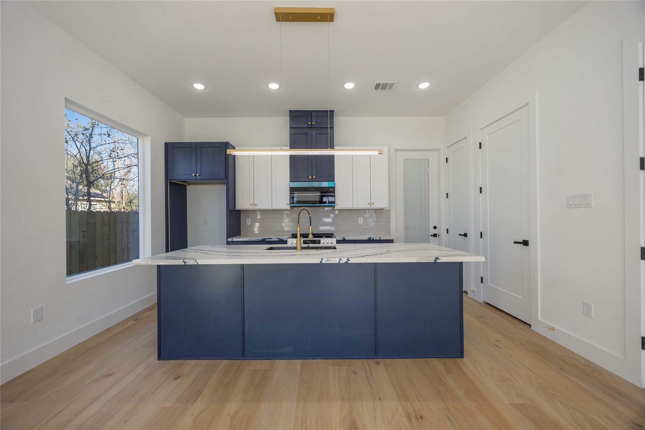 4533 Bricker Street Houston, TX 77051 - Photo 9 of 21 a kitchen with stainless steel appliances granite countertop a sink and wooden cabinets