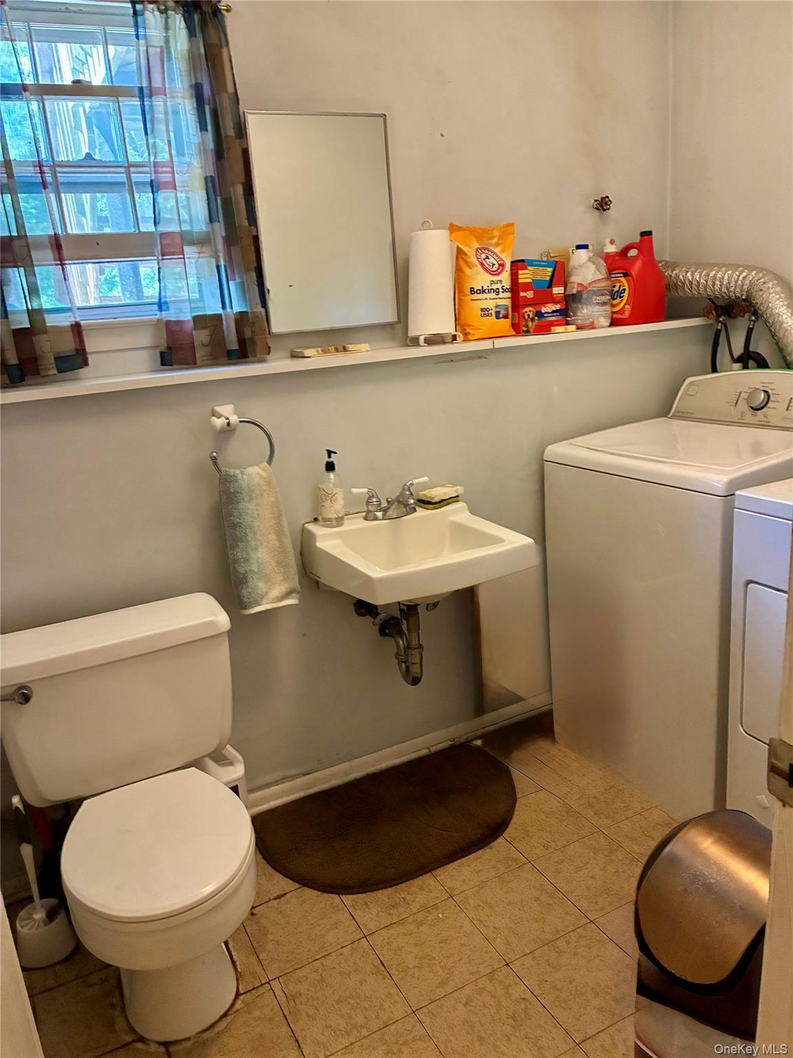 24 Ann Boulevard Spring Valley, NY 10977 - Photo 21 of 25 a bathroom with a toilet sink and mirror