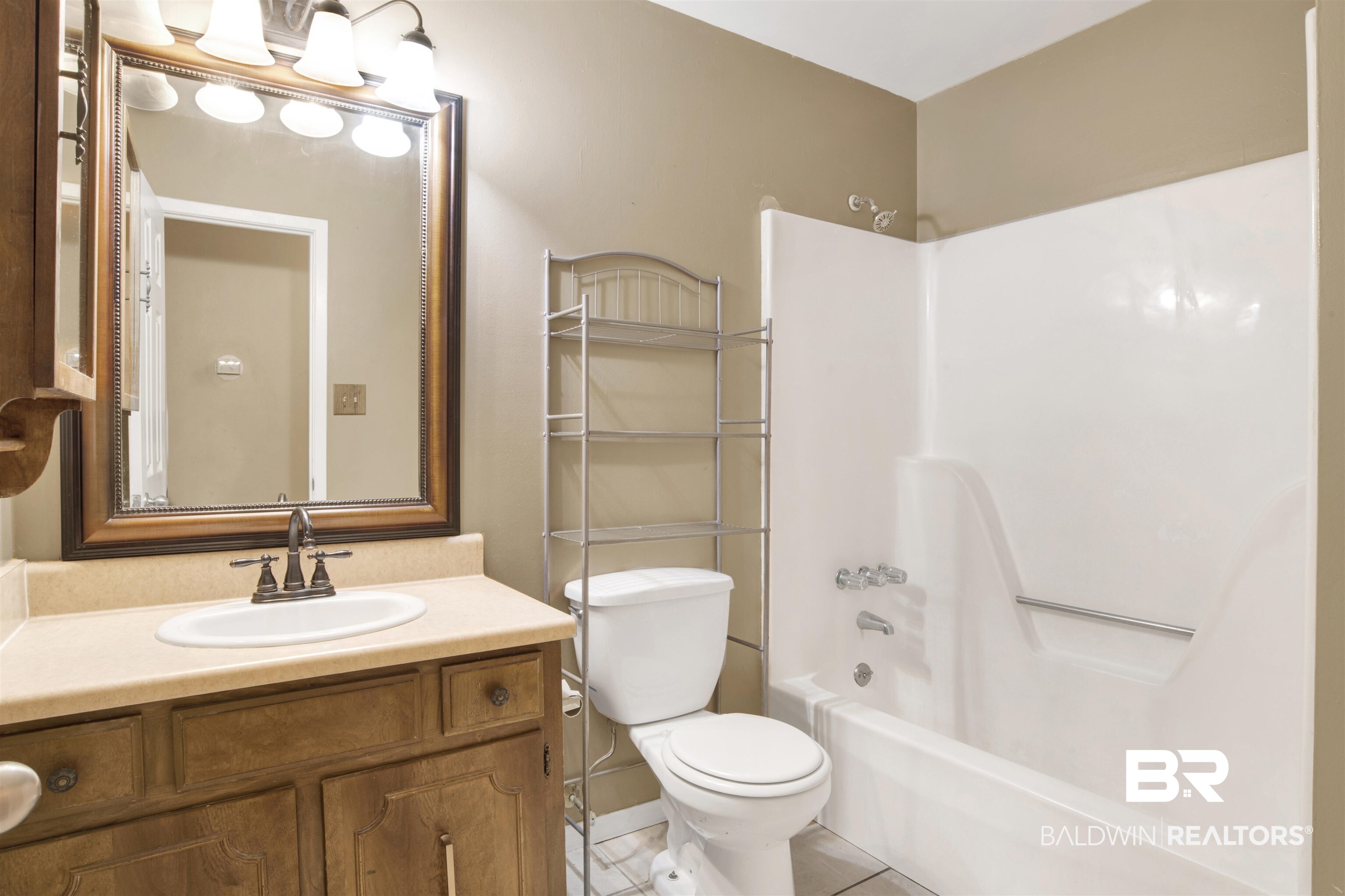 3560 Creekway Road Mobile, AL 36619 - Photo 16 of 24 Full bathroom featuring tub / shower combination, vanity, tile patterned floors, and toilet
