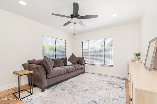 a living room with furniture and a window