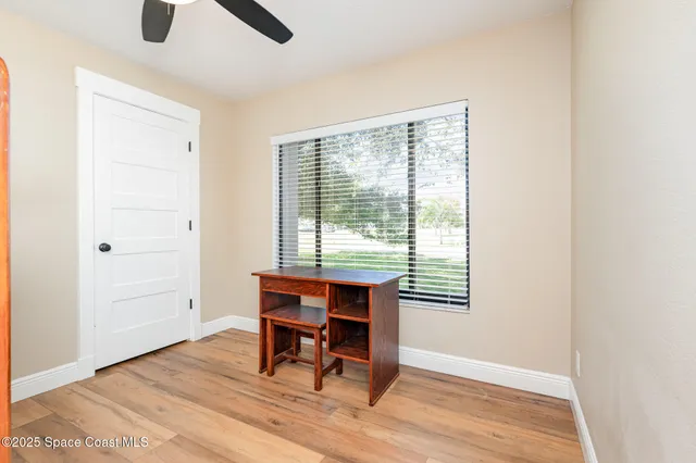 a reading room with furniture and wooden floor