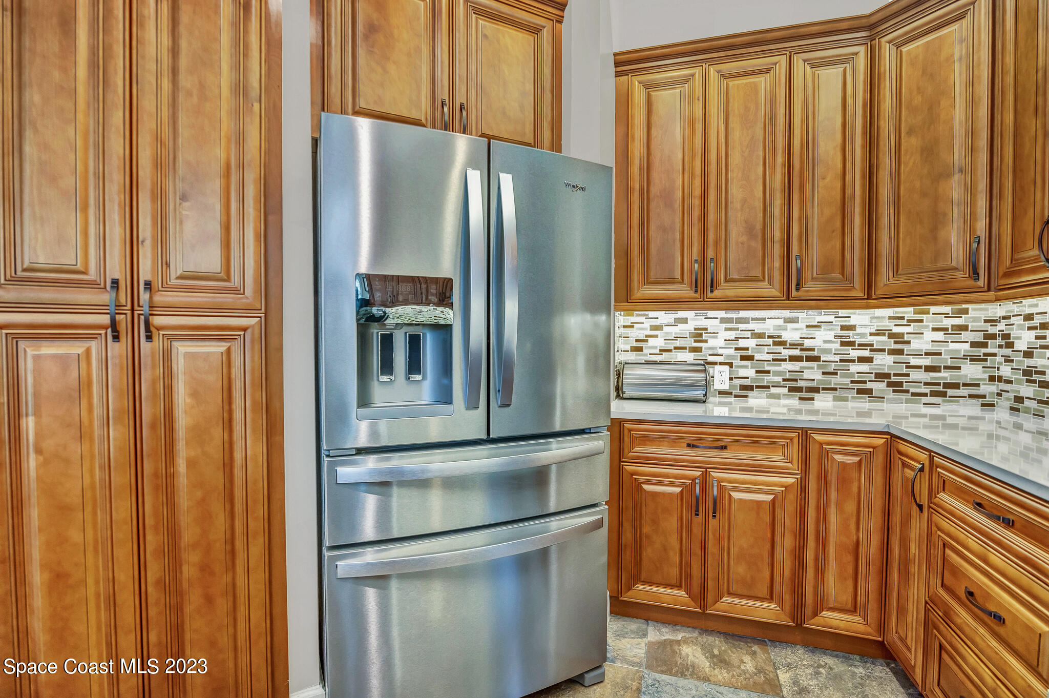 4320 Canard Road Melbourne, FL 32934 - Photo 16 of 78 a kitchen with stainless steel appliances granite countertop a refrigerator and a sink