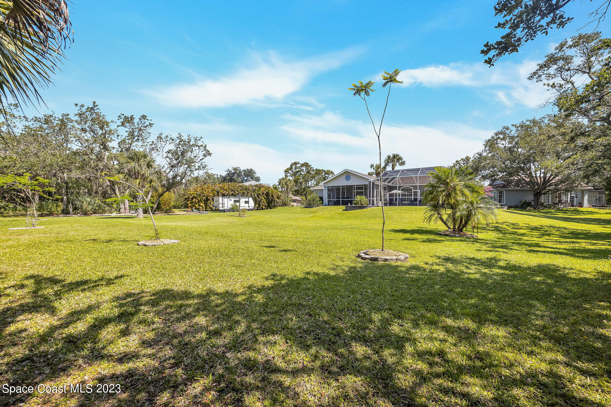4320 Canard Road Melbourne, FL 32934 - Photo 63 of 78 a view of a swimming pool with a yard