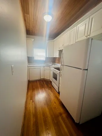 a kitchen with a refrigerator a sink and dishwasher