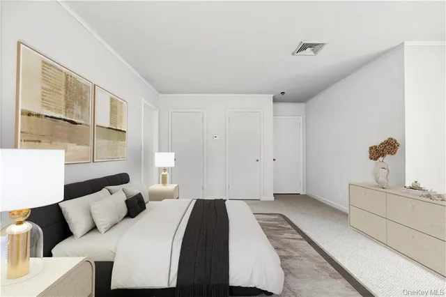 a bedroom with a bed and a cabinets