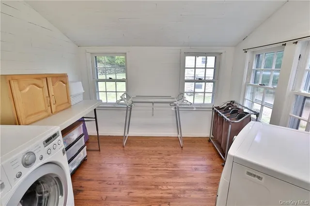 a view of a livingroom with furniture hardwood floor and a ceiling fan