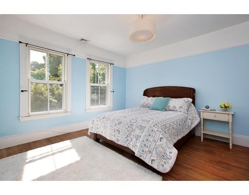 43 Hillside Road Newton, MA 02461 - Photo 14 of 17 a bedroom with a bed and wooden floor