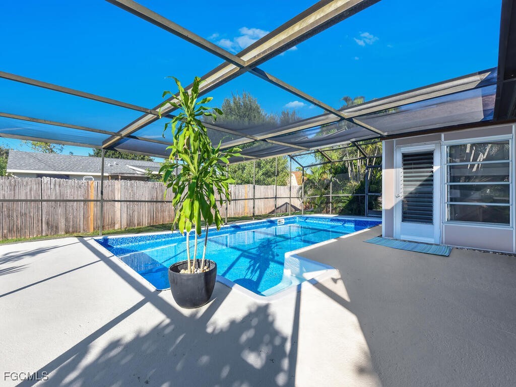 9041 Hamlin Road West Fort Myers, FL 33967 - Photo 2 of 34 a view of a backyard with table and chairs potted plants