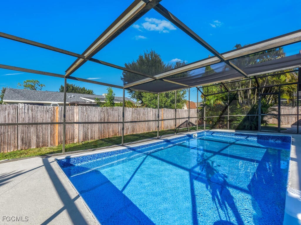 9041 Hamlin Road West Fort Myers, FL 33967 - Photo 25 of 34 a view of a backyard with a small cabin