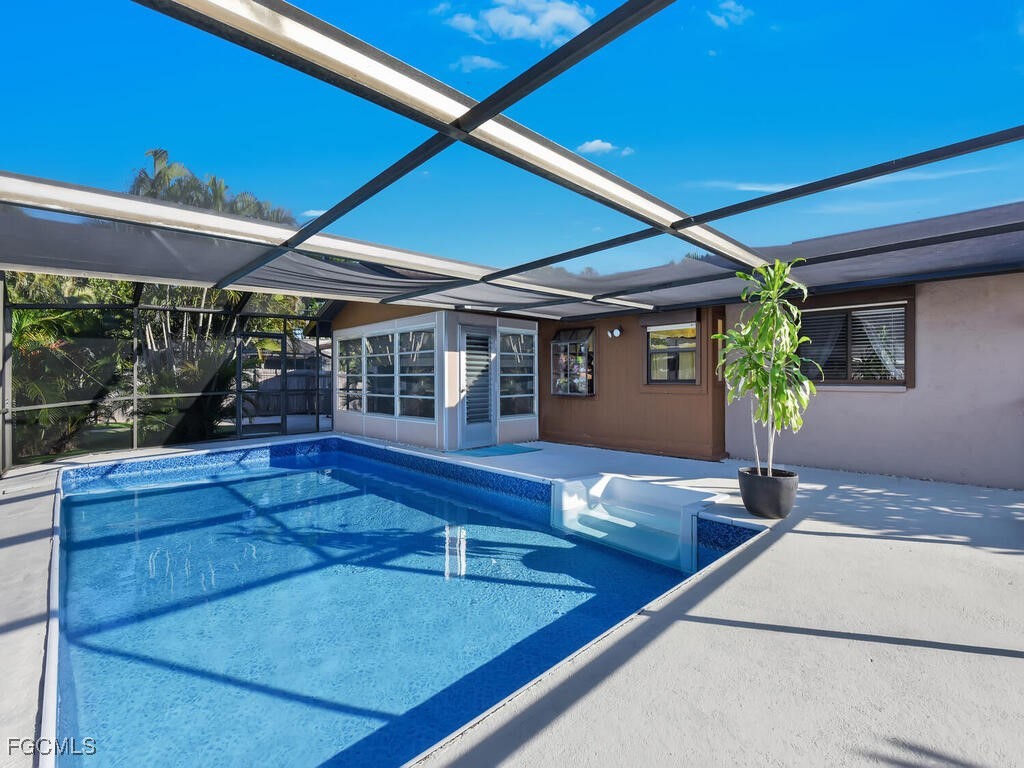 9041 Hamlin Road West Fort Myers, FL 33967 - Photo 27 of 34 a view of house with a swimming pool