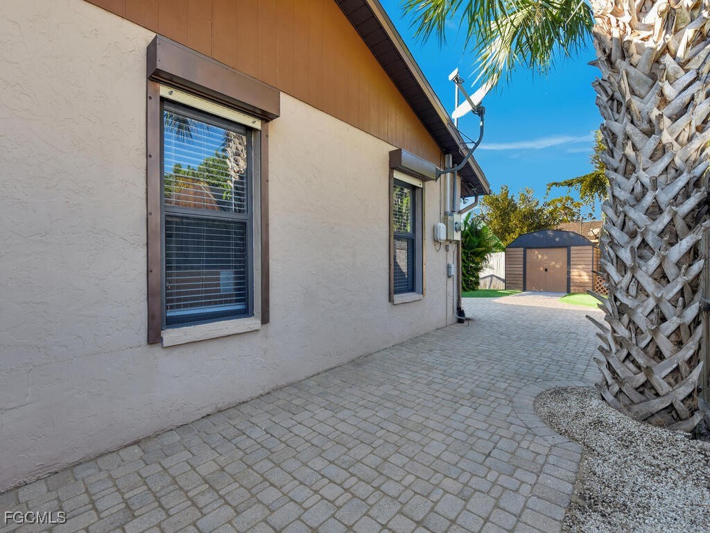 9041 Hamlin Road West Fort Myers, FL 33967 - Photo 30 of 34 a view of a house with a yard