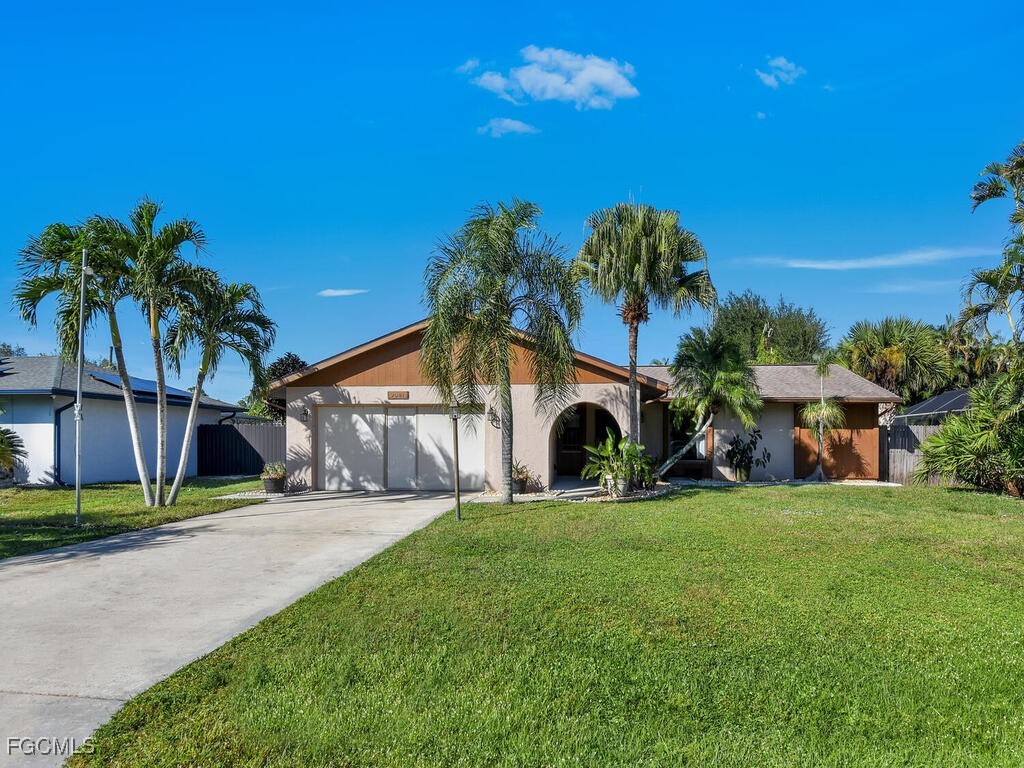 9041 Hamlin Road West Fort Myers, FL 33967 - Photo 34 of 34 a house view with a garden space