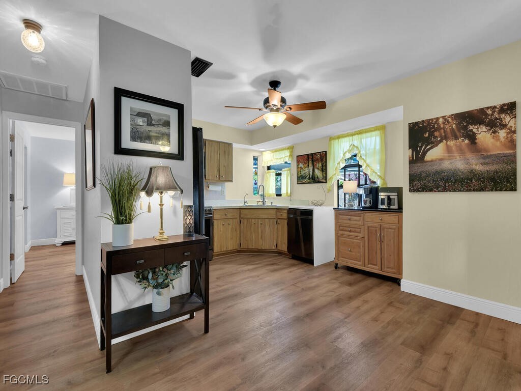 9041 Hamlin Road West Fort Myers, FL 33967 - Photo 6 of 34 a view of kitchen with furniture and wooden floor