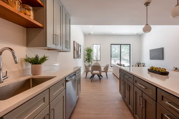 a kitchen with sink cabinets and window