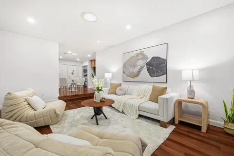 a living room with furniture and a lamp