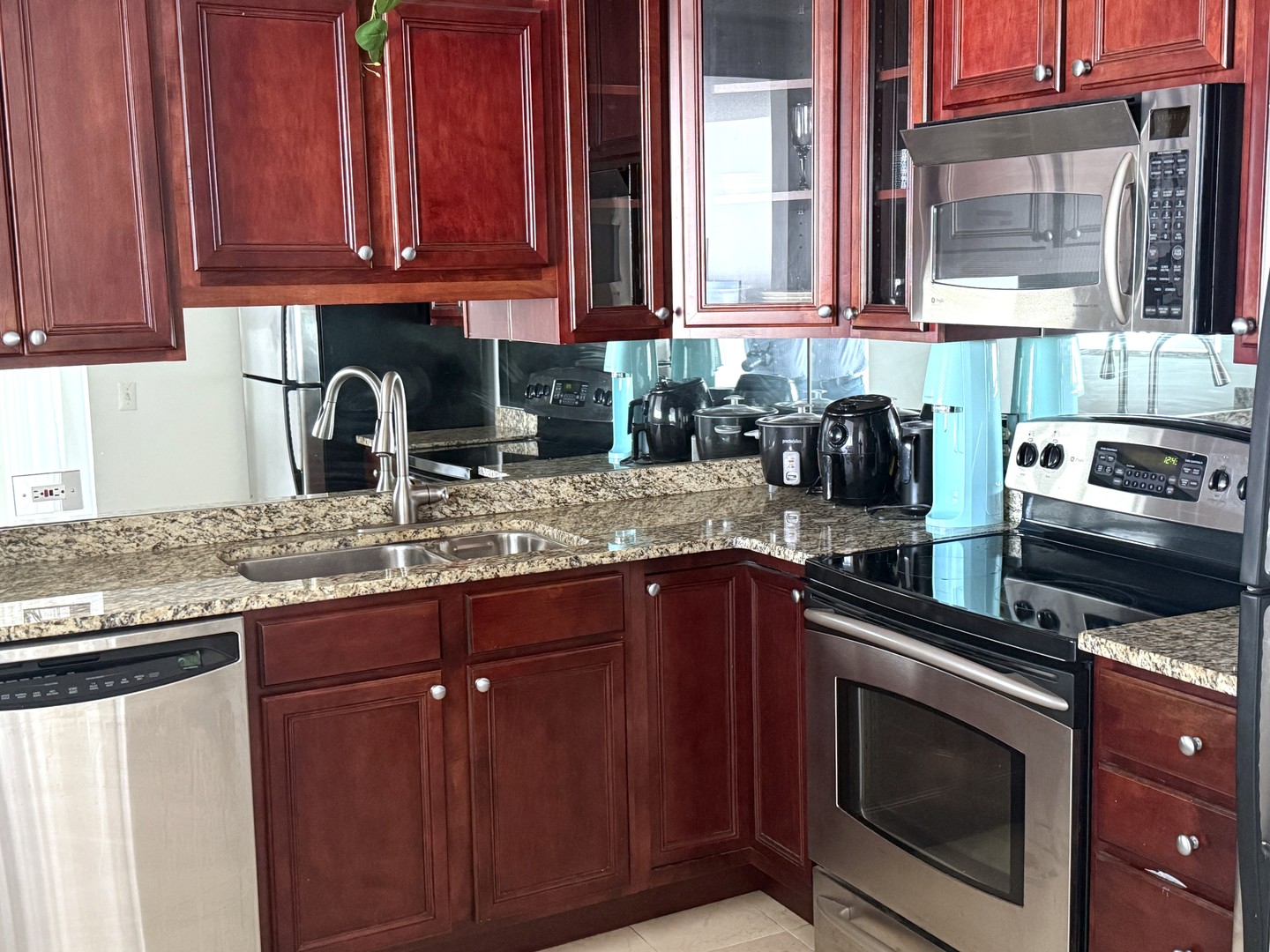 33 West Delaware Place, Unit 9D Chicago, IL 60610 - Photo 20 of 32 a kitchen with granite countertop a sink stove and cabinets