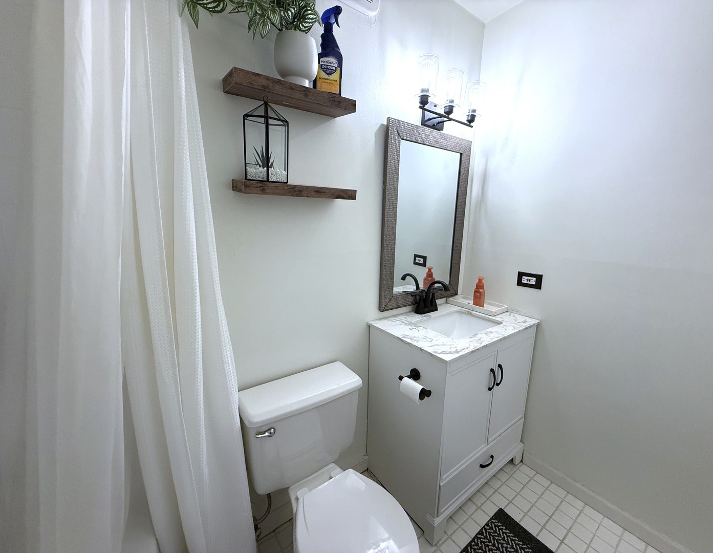 33 West Delaware Place, Unit 9D Chicago, IL 60610 - Photo 24 of 32 a bathroom with a sink vanity and toilet