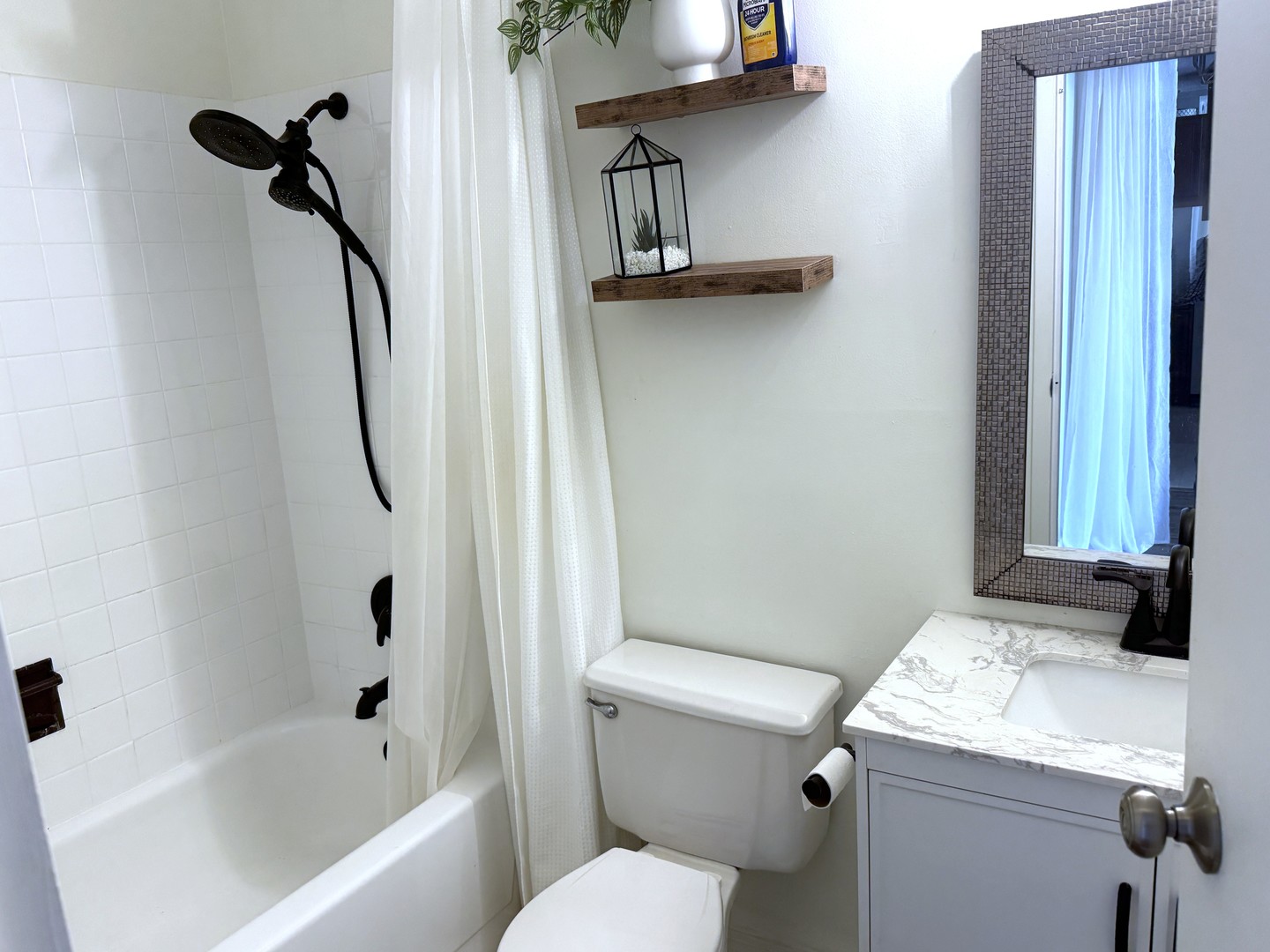 33 West Delaware Place, Unit 9D Chicago, IL 60610 - Photo 26 of 32 a bathroom with a granite countertop sink a toilet and a bathtub