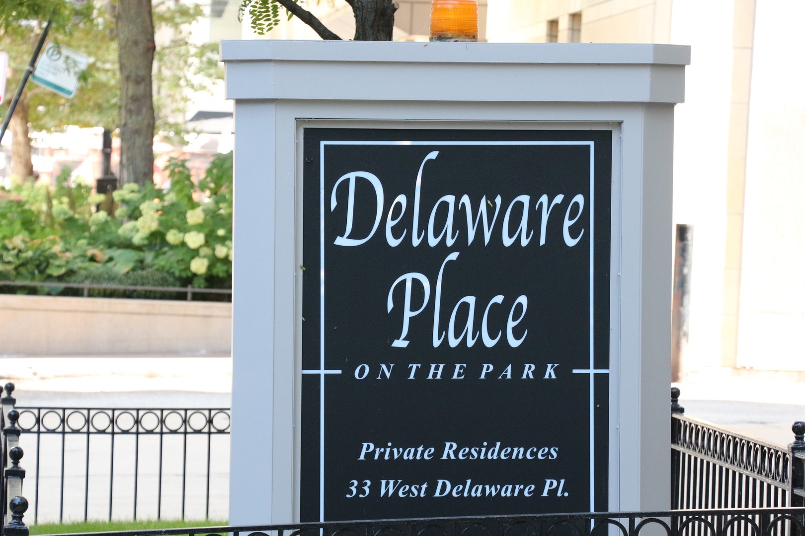 33 West Delaware Place, Unit 9D Chicago, IL 60610 - Photo 5 of 32 a close up of a street sign