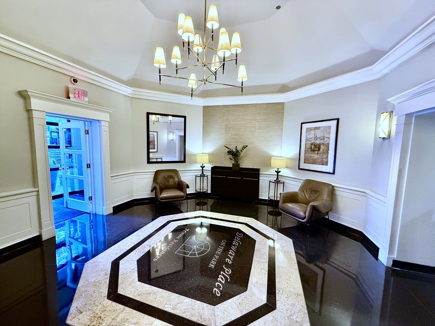 33 West Delaware Place, Unit 9D Chicago, IL 60610 - Photo 6 of 32 a living room with furniture and a chandelier