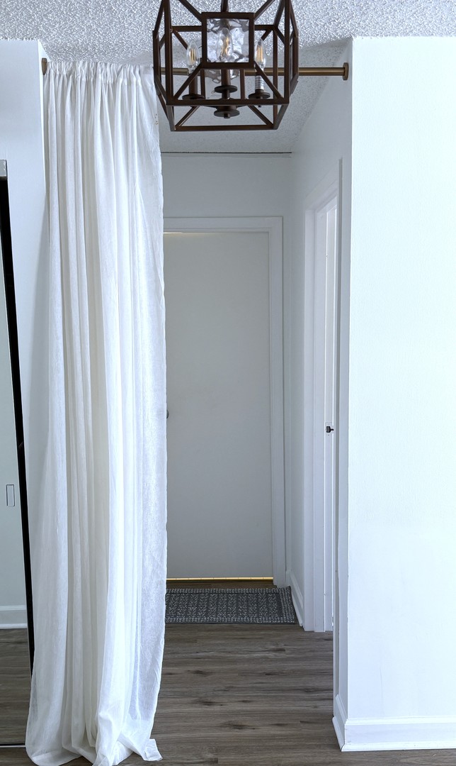 33 West Delaware Place, Unit 9D Chicago, IL 60610 - Photo 7 of 32 a view of a entryway with wooden floor