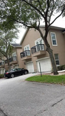 a view of street along with house and trees