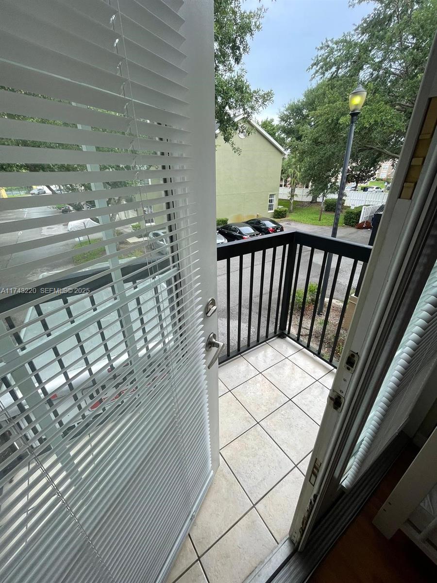 2519 Lancien Court, Unit 5 Orlando, FL 32826 - Photo 4 of 8 a view of balcony with wooden floor