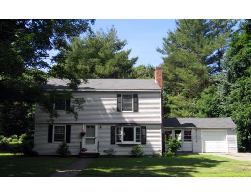 a view of house with yard