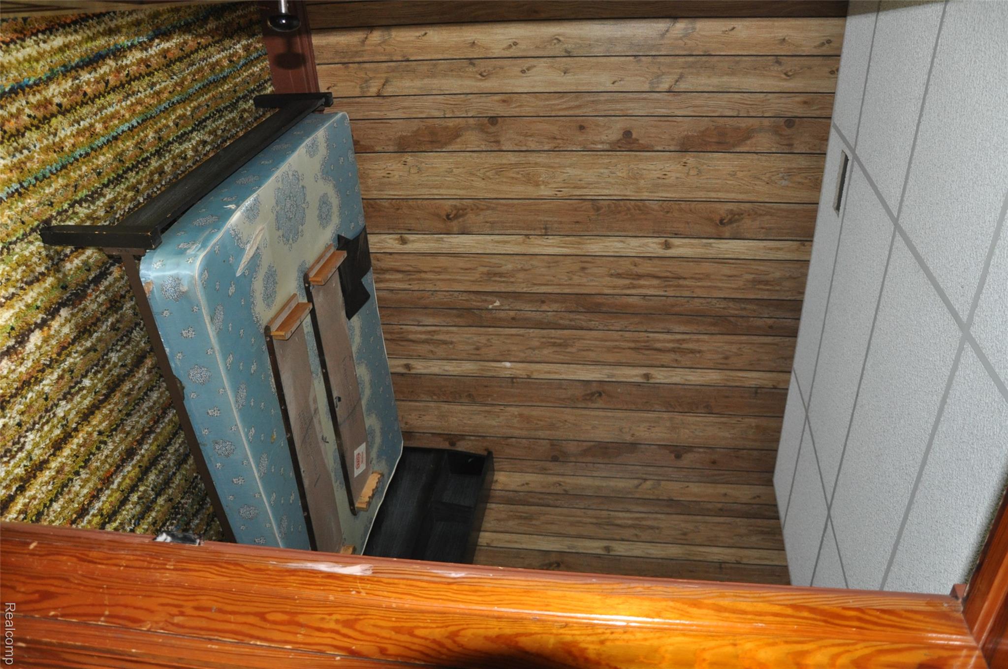 3954 Mayville Road Silverwood, MI 48760 - Photo 20 of 30 Paneling walls with wood-finish, accented by a drop ceiling