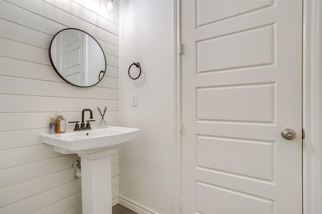 2829 Stanley Avenue Fort Worth, TX 76110 - Photo 14 of 40 a bathroom with a sink and a mirror