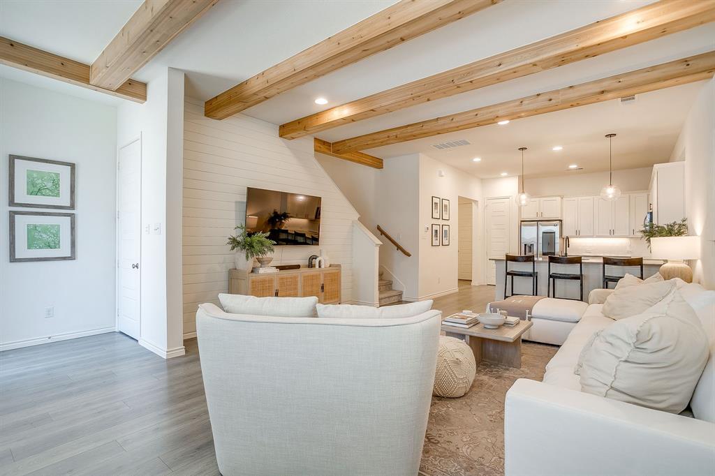 2829 Stanley Avenue Fort Worth, TX 76110 - Photo 2 of 40 a living room with furniture and a flat screen tv