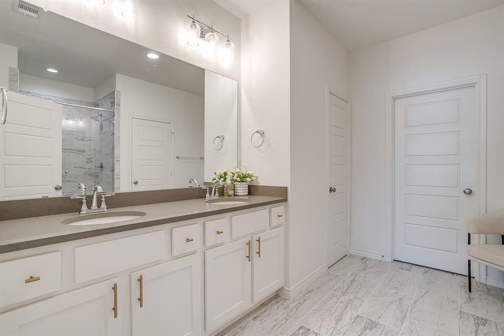 2829 Stanley Avenue Fort Worth, TX 76110 - Photo 19 of 40 a bathroom with a granite countertop sink double and mirror