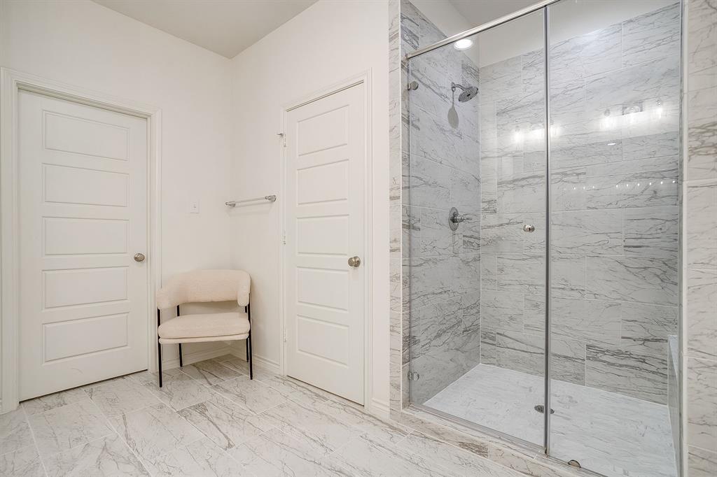 2829 Stanley Avenue Fort Worth, TX 76110 - Photo 23 of 40 a bathroom with a shower and toilet