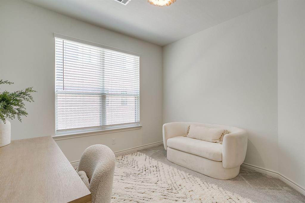 2829 Stanley Avenue Fort Worth, TX 76110 - Photo 26 of 40 a living room with furniture and a window