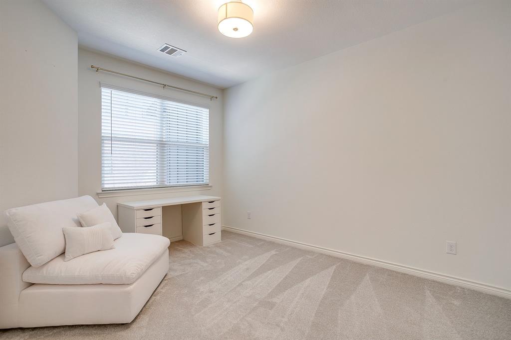 2829 Stanley Avenue Fort Worth, TX 76110 - Photo 30 of 40 an empty room with a window and a couch