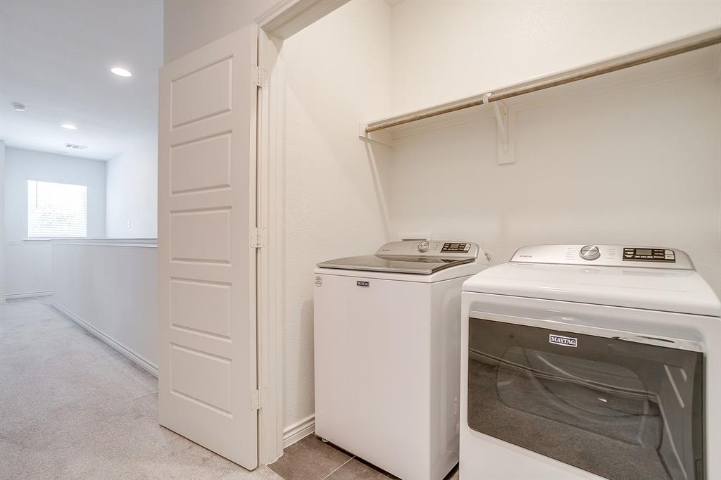2829 Stanley Avenue Fort Worth, TX 76110 - Photo 32 of 40 a utility room with dryer and washer