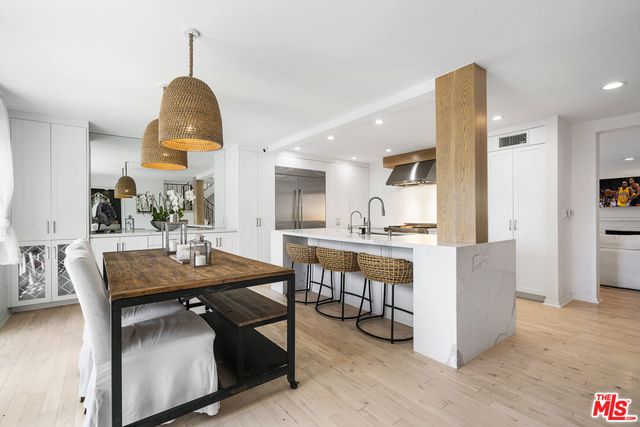 a view of kitchen with cabinets and wooden floor