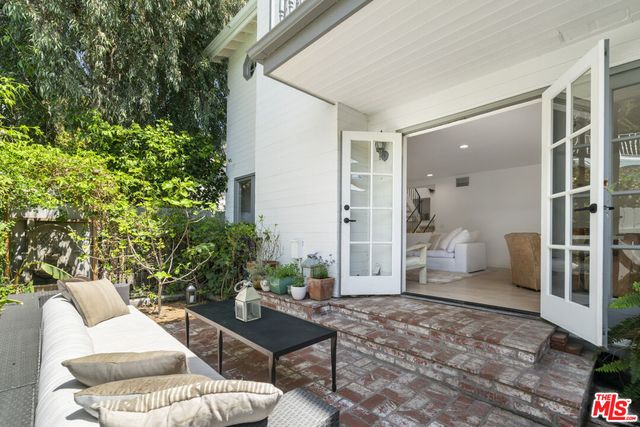 a outdoor space with patio couches and a potted plant