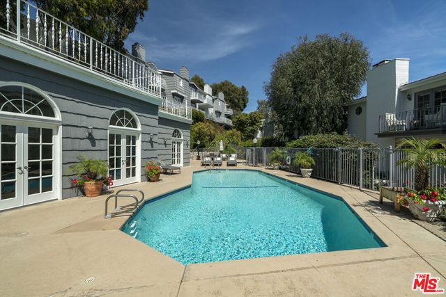 a view of a swimming pool with a patio