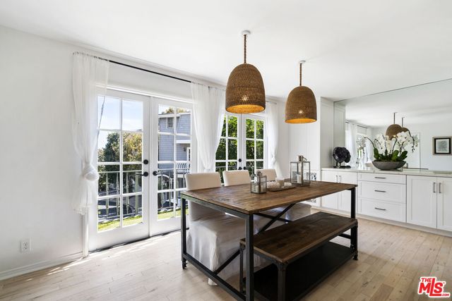 a room with wooden floor and window