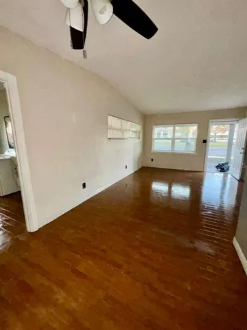 a view of an empty room with a window