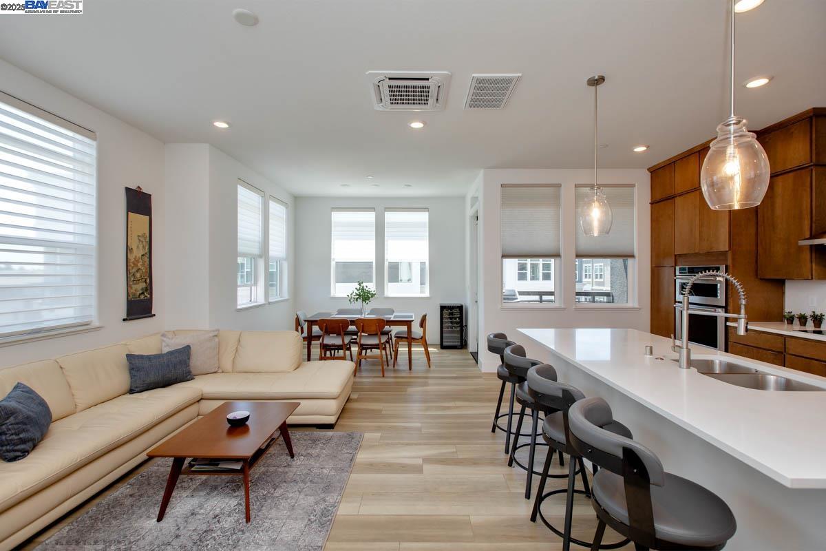 2885 Tradewind Drive Alameda, CA 94501 - Photo 3 of 12 a living room with furniture and a large window