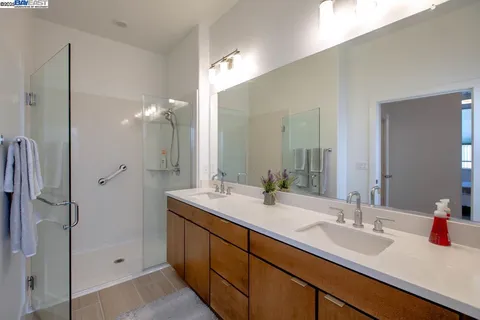 a bathroom with a double vanity sink mirror and double