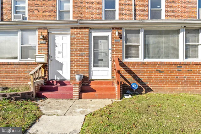 a view of two chairs in the balcony